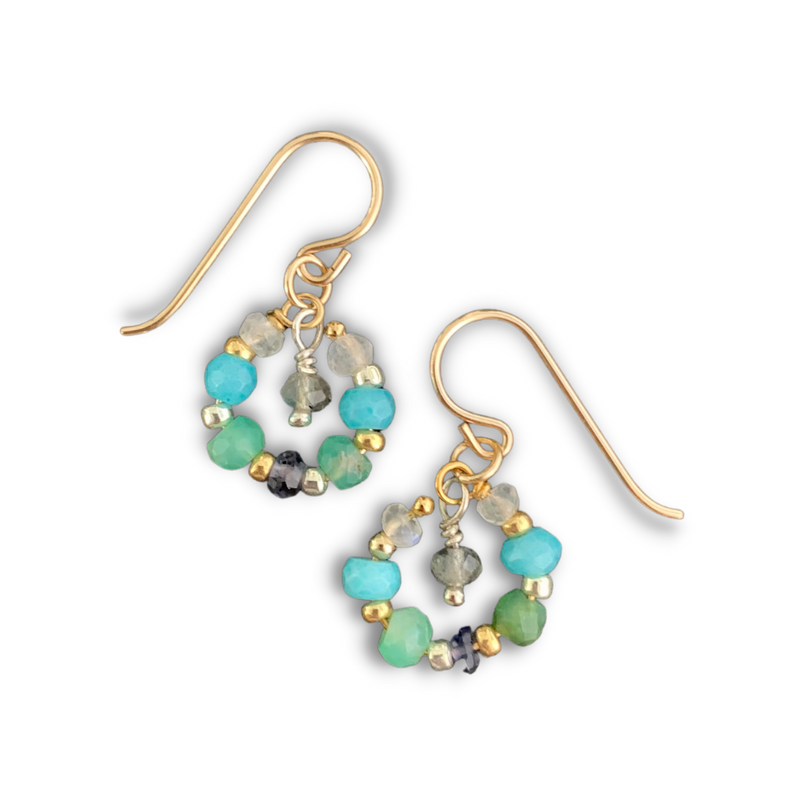 These colors are inspired by the island getaway we all need right now, and they cost a lot less than island hopping. Aqua chalcedony, chrysoprase, glass, iolite, labradorite, and rainbow moonstone faceted gemstones with 14k gold-dill earwires. 1" length.