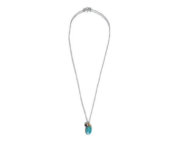 Captivating amazonite gemstone set in 14k gold fill with a lab-created blue sapphire accent on a sterling silver chain necklace. Adjustable from 18" to 20".