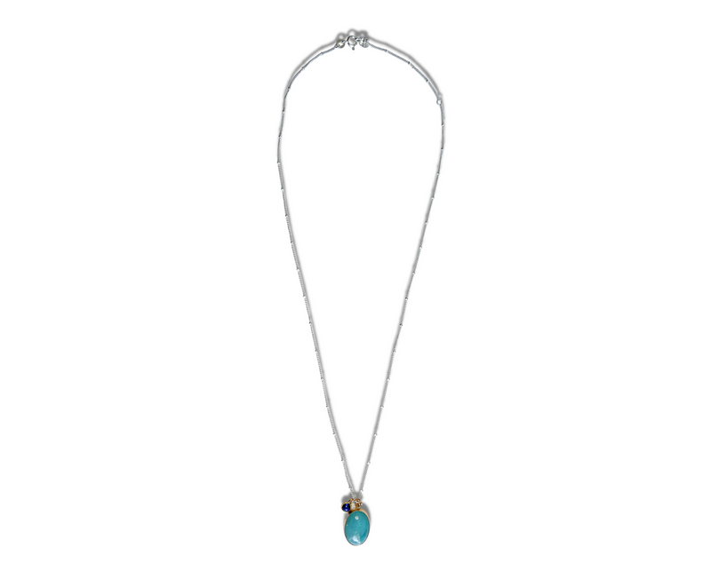 Captivating amazonite gemstone set in 14k gold fill with a lab-created blue sapphire accent on a sterling silver chain necklace. Adjustable from 18" to 20".