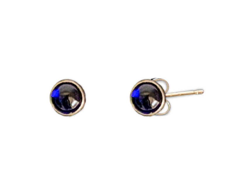Sapphire is said to attract abundance, blessings, and gifts. These gleaming blue sapphire stud earrings are handset in 14k gold fill and add a hint of glamour to your look. 4mm.
