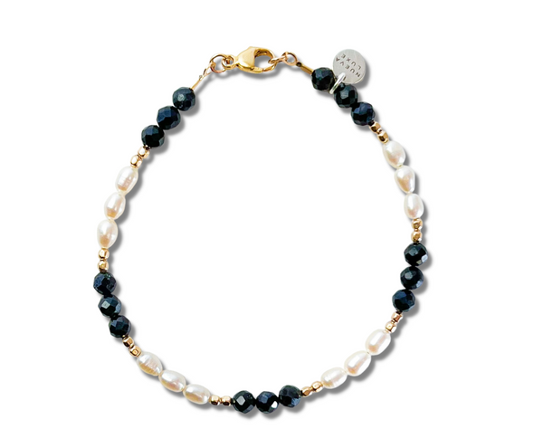 Deep blue faceted sapphires with white freshwater pearls and gold-fill beads. 7" with a 14k gold-fill lobster clasp.